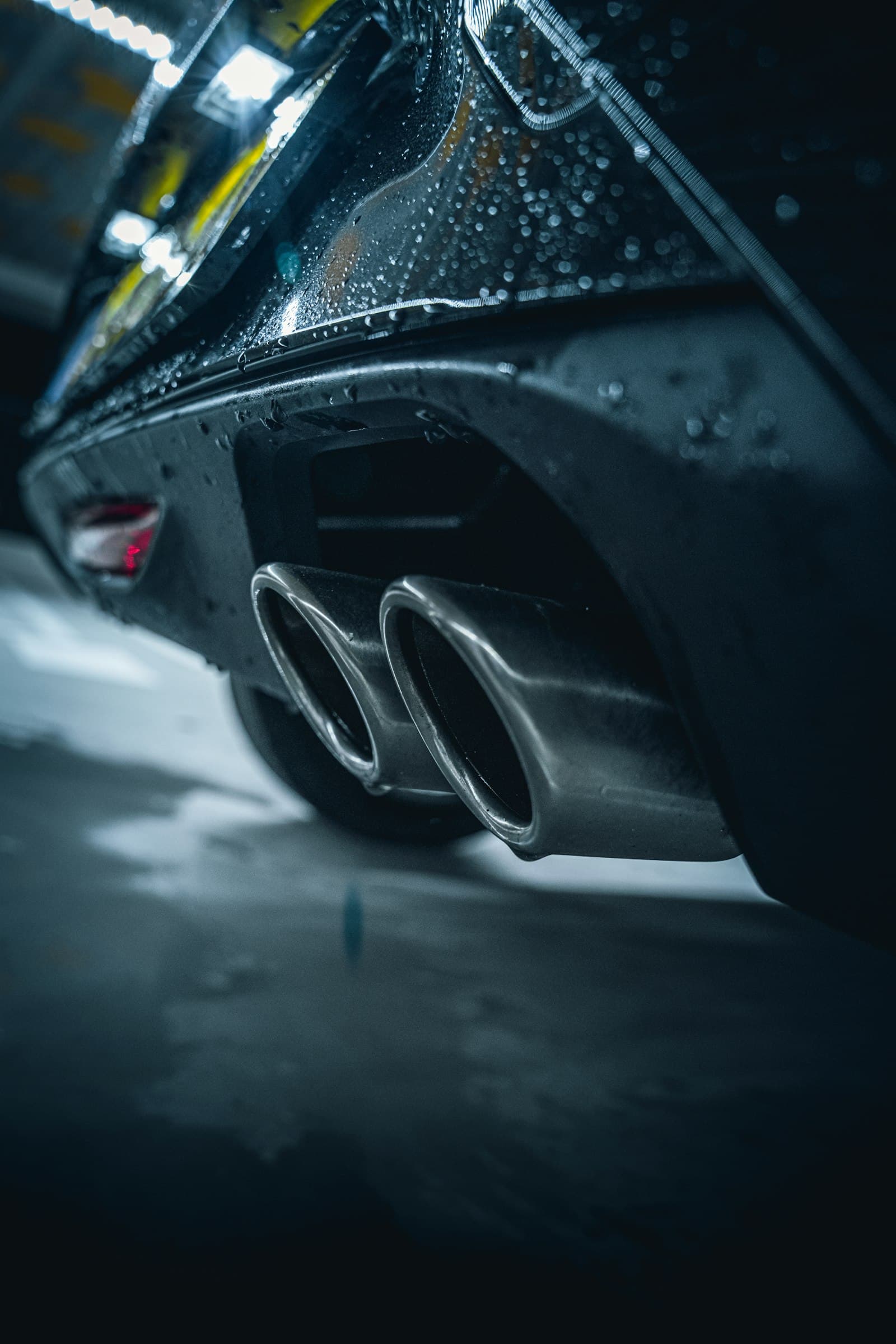 Polished exhaust tips on a detailed car