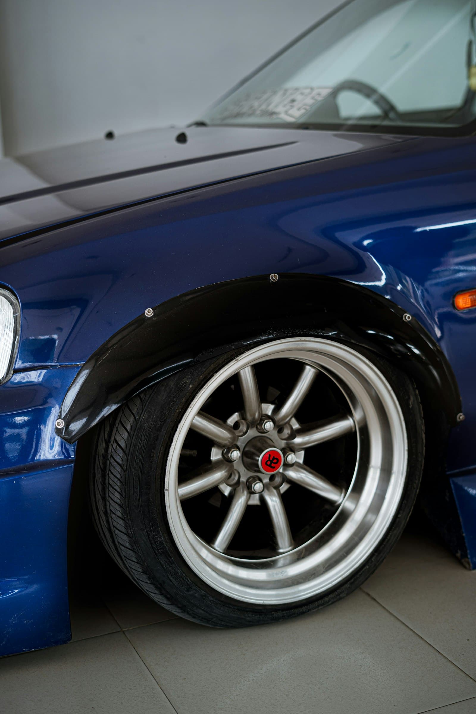 A corrected, mirror-gloss car panel reflecting light